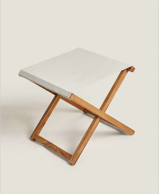 Taburete plegable de madera de teka con asiento de algodón de Zara Home