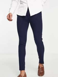 Pantalones de vestir azul marino de corte superpitillo de ASOS DESIGN / Y Vaqueros Elásticos Azul o Negro por 3€.